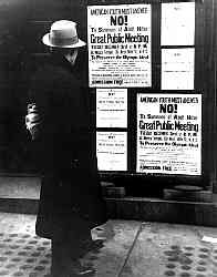 A passerby in New York City reads a notice announcing a public meeting to urge Americans to boycott the 1936 Berlin Olympics.