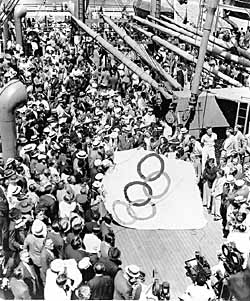 The team, shown here preparing to hoist the Olympic flag on the ship <i>Manhattan</i>. American Olympic President Avery Brundage led the delegation.