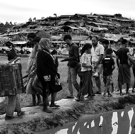 Rohingya walk into a section of Balukhali refugee camp in Bangladesh, September 2017.