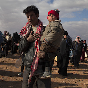 Refugees crossed into Jordan from Syria at a border crossing known as Al Hadalat, on the far eastern part of the border. Many of the refugees hail from Dara'a and were fleeing heavy fighting. February 2014.