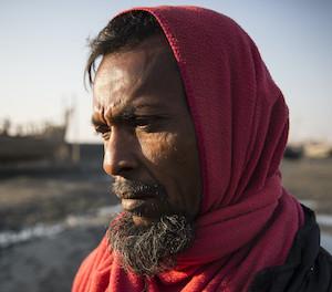 A man stands outside of Sittwe, in Rakhine State, Myanmar, near camps for internally displaced Rohingya.