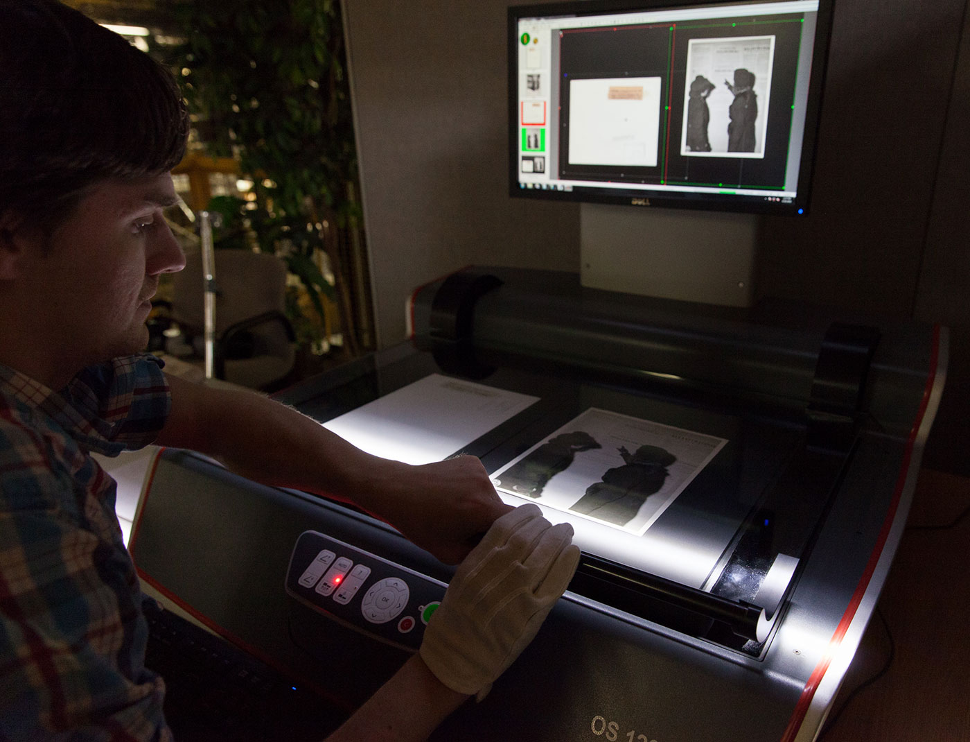 A museum employee digitizes an artifact