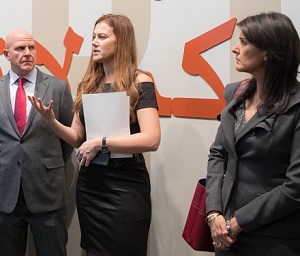 Simon-Skjodt Center Deputy Director Naomi Kikoler tours the UNSC delegation through the Syria exhibition.