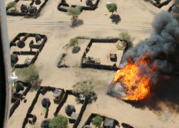 The burning of Um Ziefa in Darfur, Sudan. December 12, 2004. 