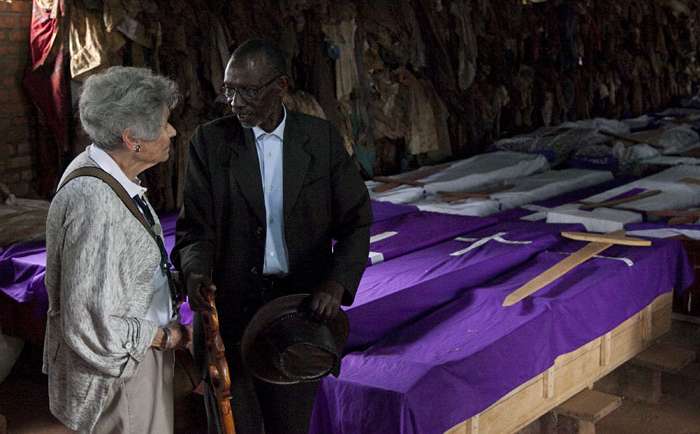 Margit Meissner, a survivor of the Holocaust, and Jean Baptiste Munyankor, a survivor of the Rwandan genocide, talk inside Ntarama Memorial Church in Rwanda, April 1, 2014.