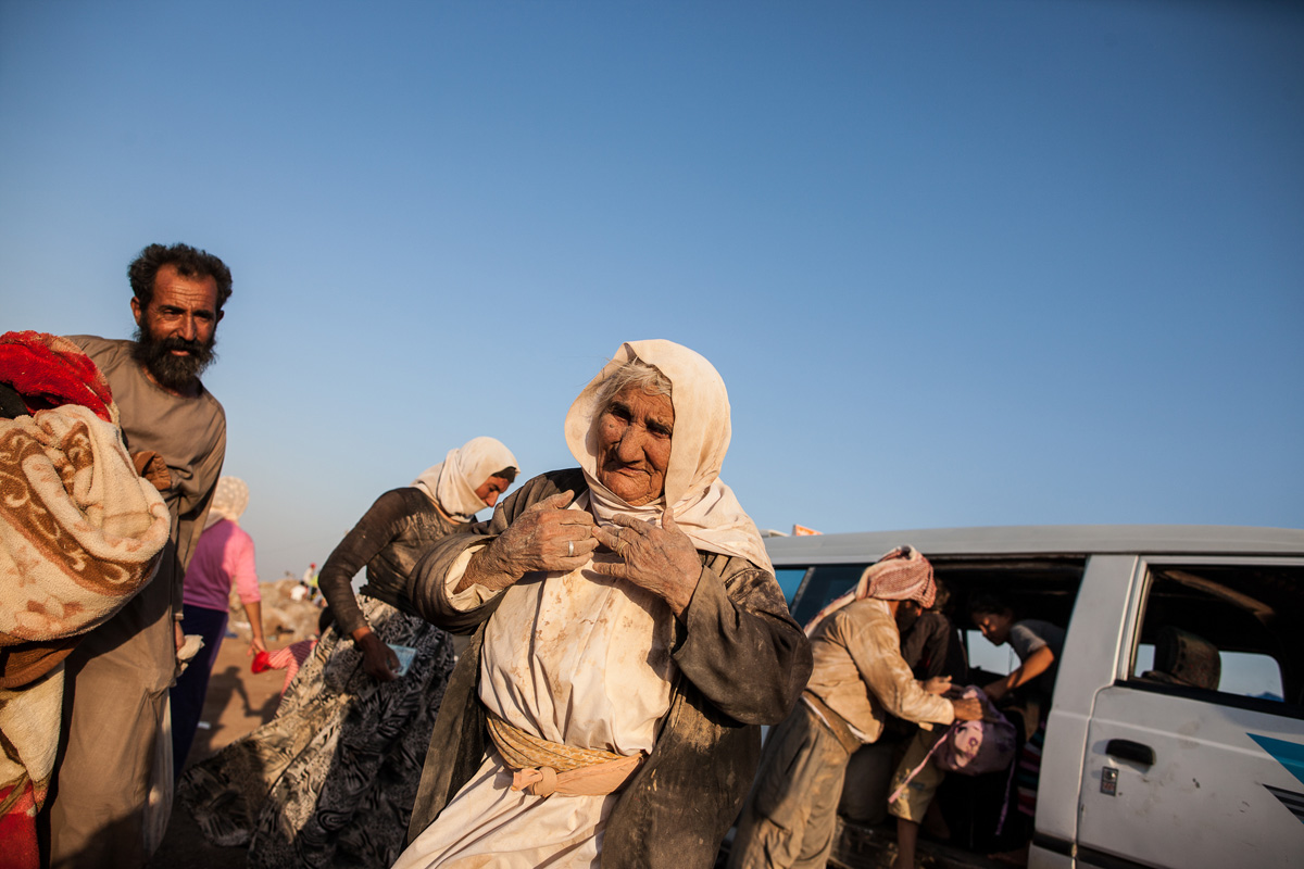 This Yezidi woman, age 85, walked for five days to escape from Mount Sinjar in 2014. She took a van for the last kilometer to a refugee camp across the border in Syria.