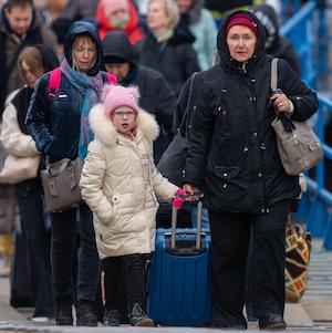 Refugee Ukrainians walk from Ukraine to Isaccea in Romania after crossing the border. March, 5, 2022.