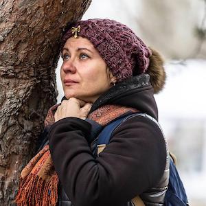 A woman mourns as she looks at destroyed residential building as a result of a missile strike 4 days ago in Ukrainian city of Dnipro on January 17, 2023. More than 40 victims, including children were killed when Russian missile striked residential building on Saturday.