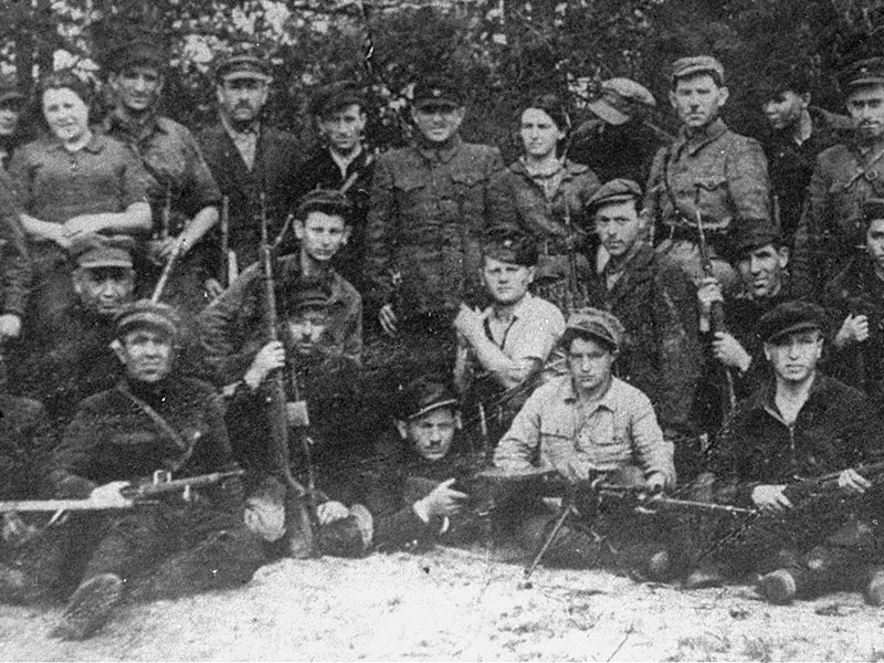 Resistance fighters pose with their weapons