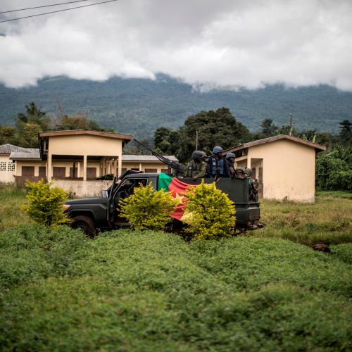 An armoured pick up of the Cameroonian army secures the perimeter of a polling station in Lysoka, near Buea, Southwestern Cameroon, on October 7, 2018 during the presidential election. 