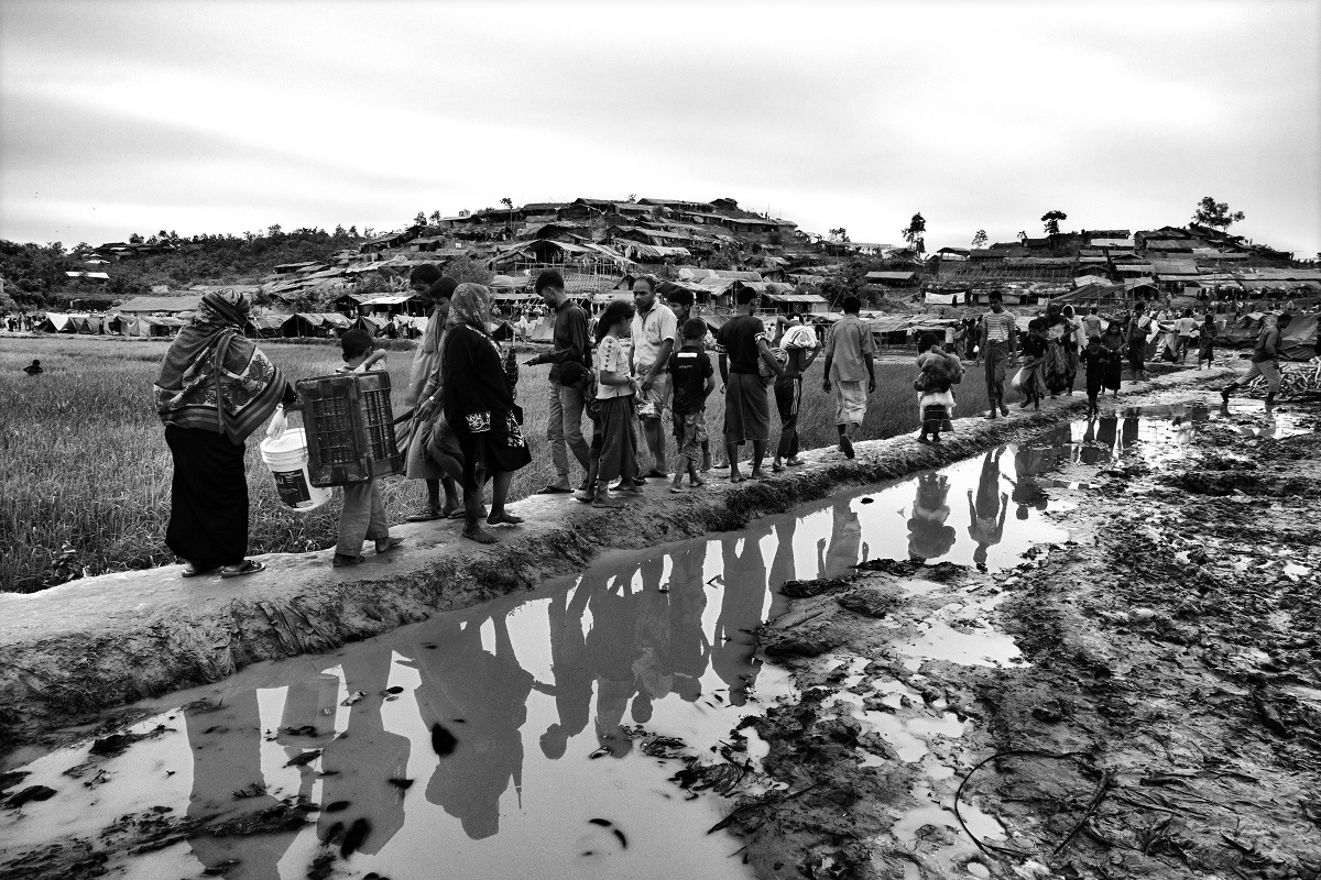 Rohingya walk into a section of Balukhali refugee camp in Bangladesh, September 2017.