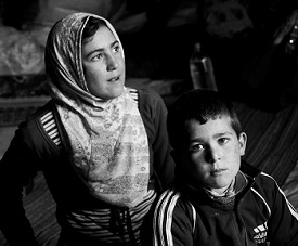 After fleeing the Syrian regime's bombardment of their hometown, an extended family totaling 16 has been living in a cave outside the village of Asseharia, north of Hama. 