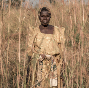 A South Sudanese refugee woman stands for a portrait while waiting to be taken to a refugee camp near Aba, Democratic Republic of the Congo, after fleeing fighting in South Sudan, on December 23, 2017.