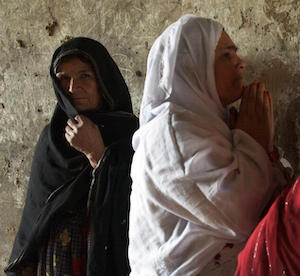 Women gather in the corridor of their home in Bagram, Afghanistan. September 2009.