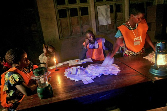 Election officers count votes late into the night after elections in Bunia, DRC. October 29, 2006. UN Photo/Martine Perret