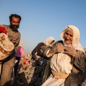 This Yezidi woman, age 85, walked for five days to escape from Mount Sinjar in 2014. She took a van for the last kilometer to a refugee camp across the border in Syria.